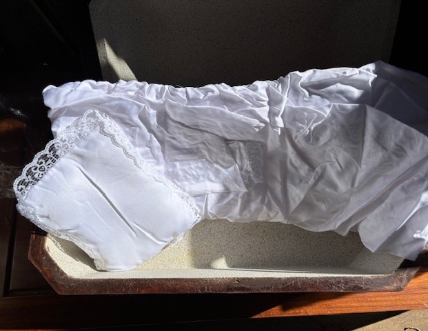 The Pet Casket deluxe lined, Medium Oak finish, in original box.